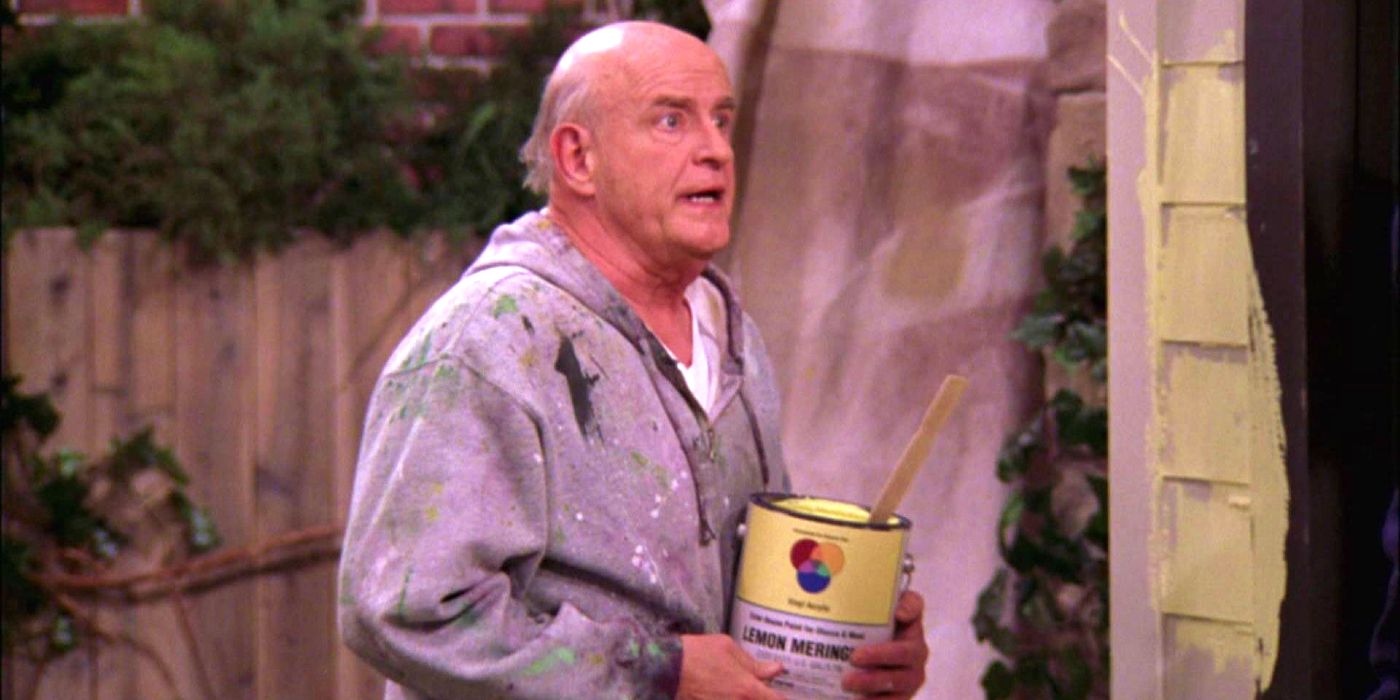 Frank from Everybody Loves Raymond holding a paint can looking angry.