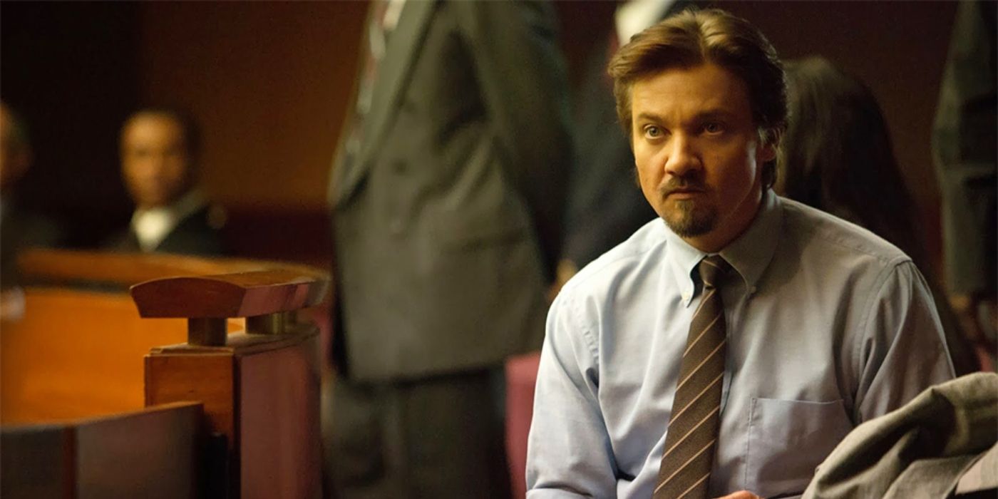 Jeremy Renner sitting in a court room in Kill the Messenger