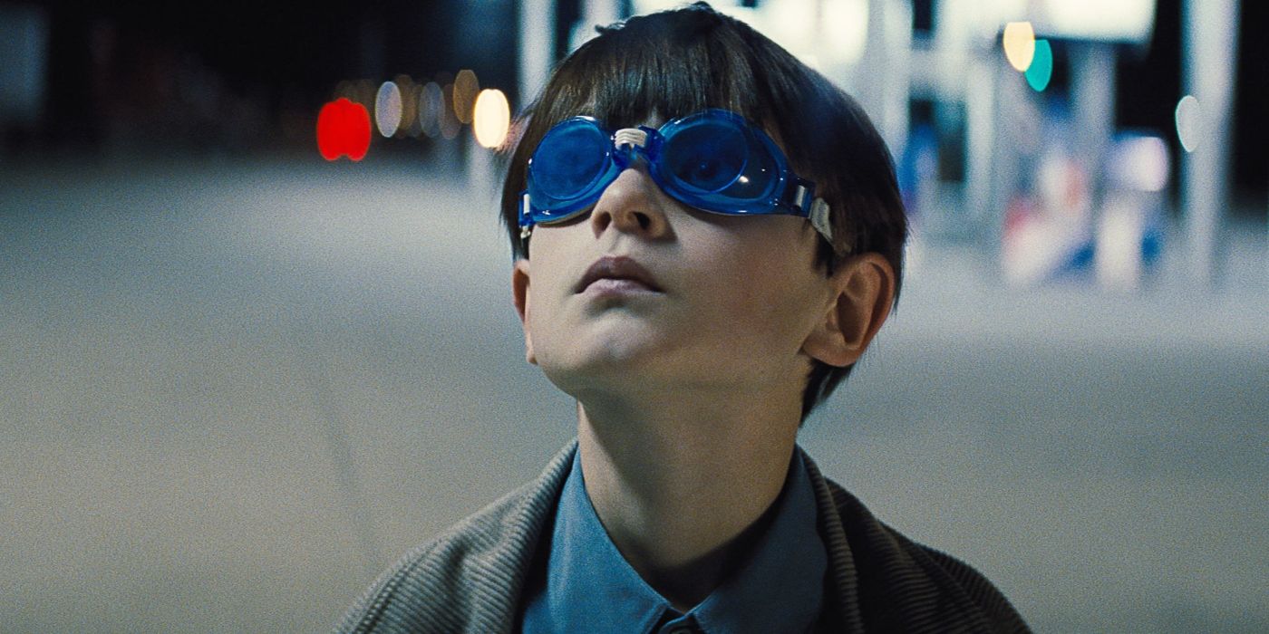 Alton wearing glasses and looking up in Midnight Special