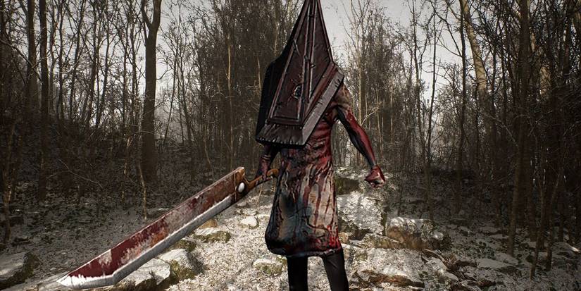 Pyramid Head covered in blood and holding a large blade in Silent Hill