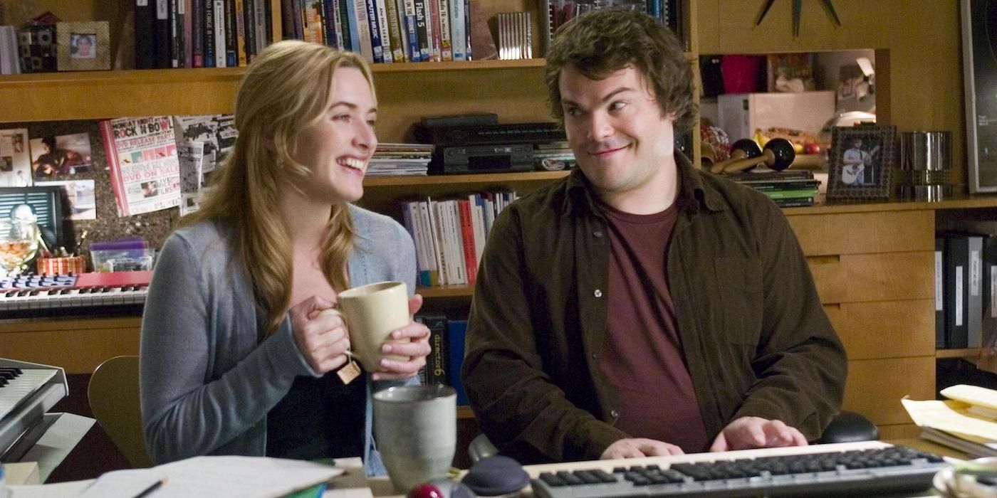 Kate Winslet and Jack Black sit at the piano in The Holiday