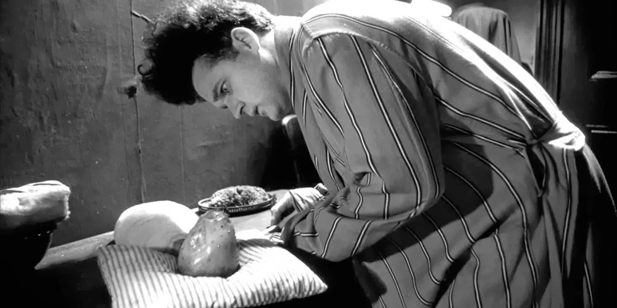 Henry Spencer looks at his mutant baby in Eraserhead