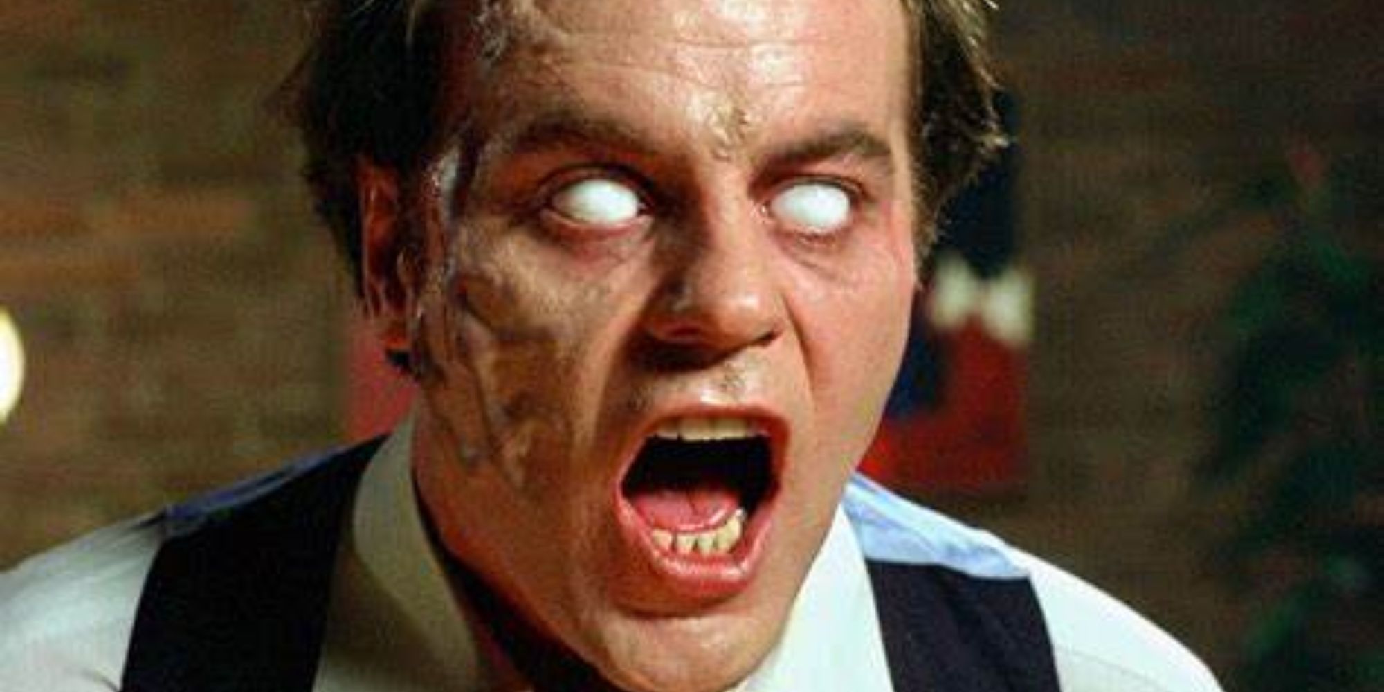 Darryl Revok, played by Michael Ironside, with white eyes and his mouth open in Scanners