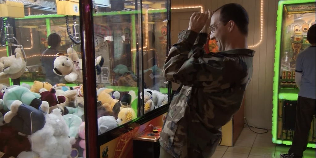 Buster Winning Stuffed Animals from A Claw Machine in 'Arrested Development'