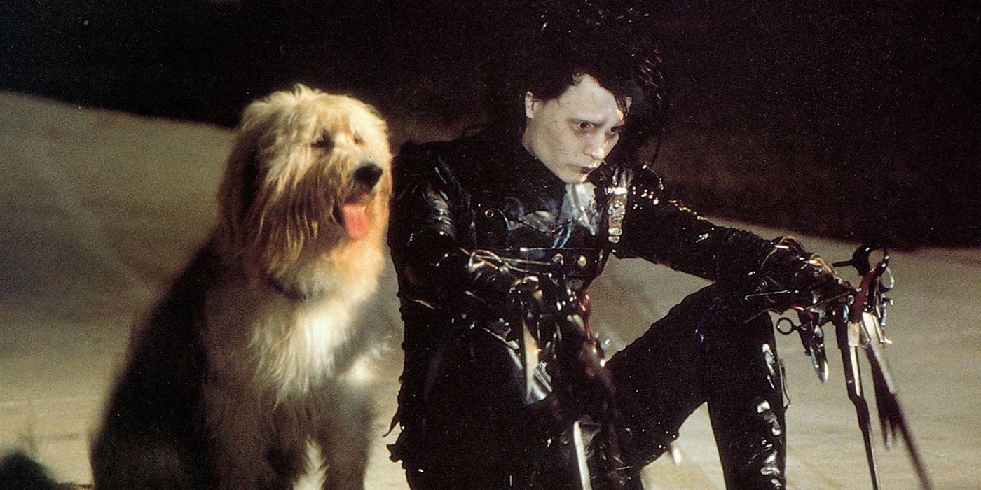 Edward Scissorhands sitting with a dog