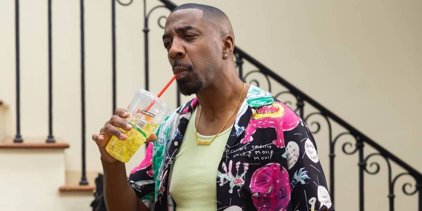 J. B. Smoove in Curb Your Enthusiasm drinking a soda by the stairs