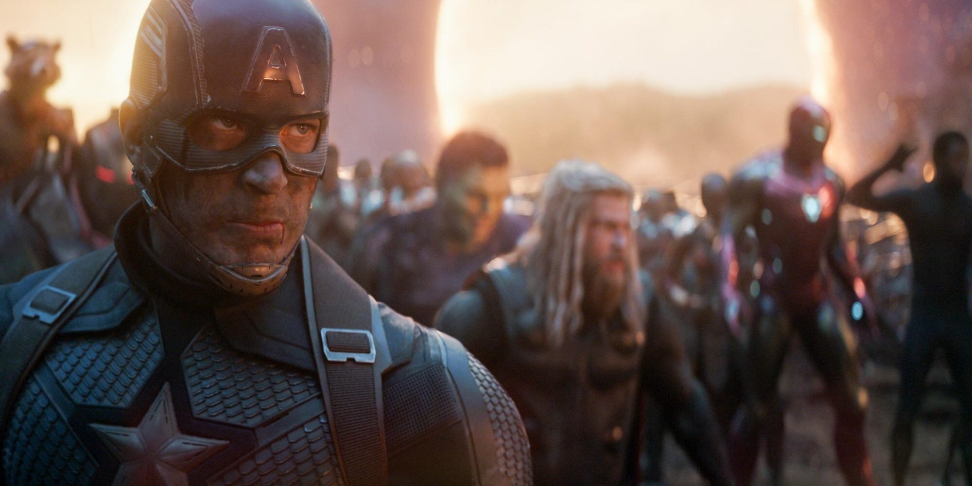 Tired Captain America close-up with roster of MCU heroes entering through portals in background