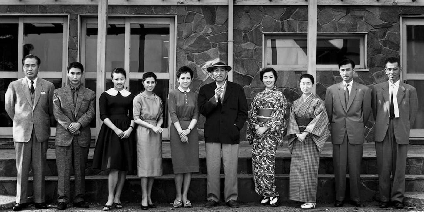 The cast standing together in Early Summer
