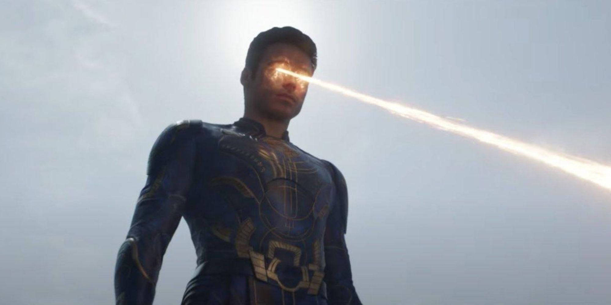 Richard Madden as Ikaris using his golden yellow energy blasts in the film Eternals