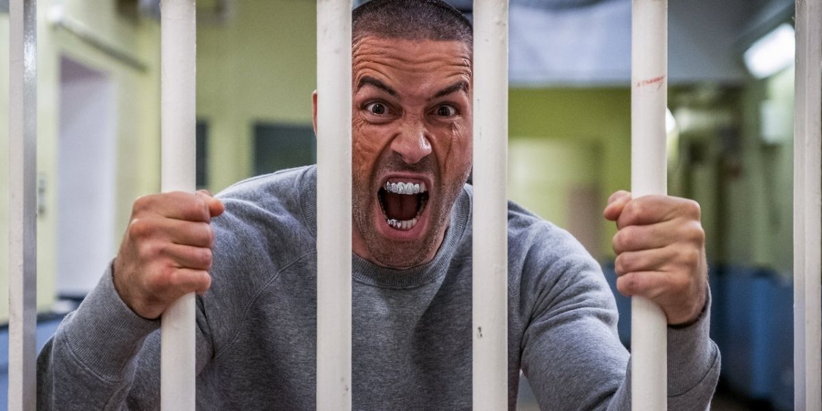 Scott Adkins behind bars in Avengement