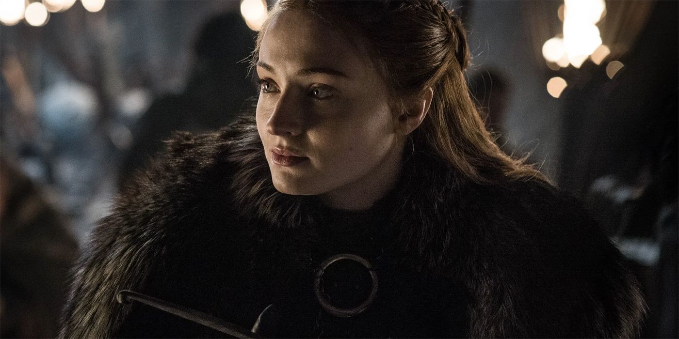 Sophie Turner as Sansa Stark, wearing a thick fur cape in Game of Thrones