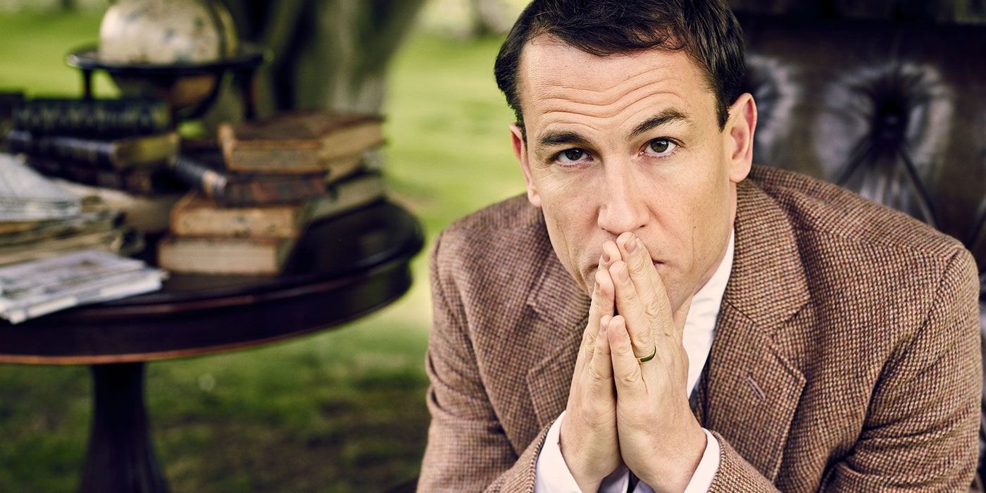 Tobias Menzies with his hands at his mouth