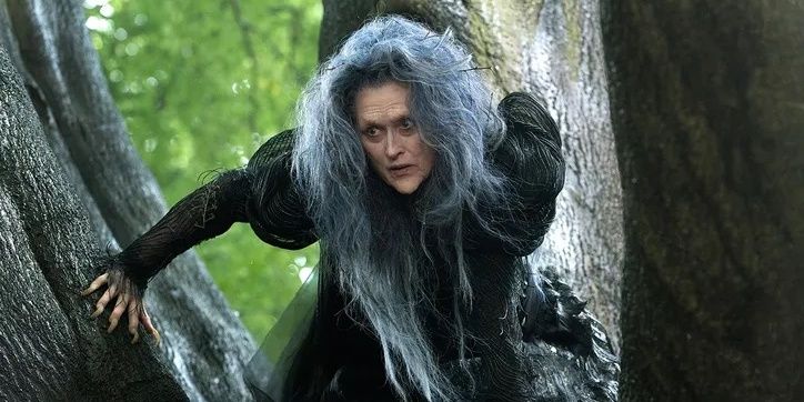 Meryl Streep as The Witch sitting in a tree in the movie Into the Woods