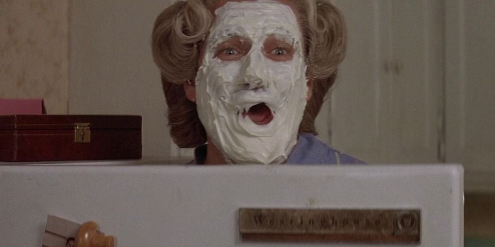 Robin Williams as Mrs Doubtfire with icing on her face in &lsquo;Mrs. Doubtfire&rsquo;.