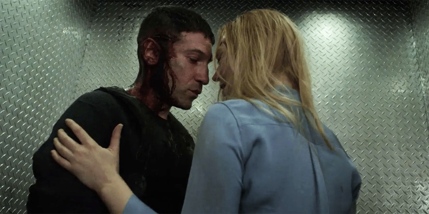 Jon Bernthal and Deborah Ann are about to kiss in 'The Punisher'