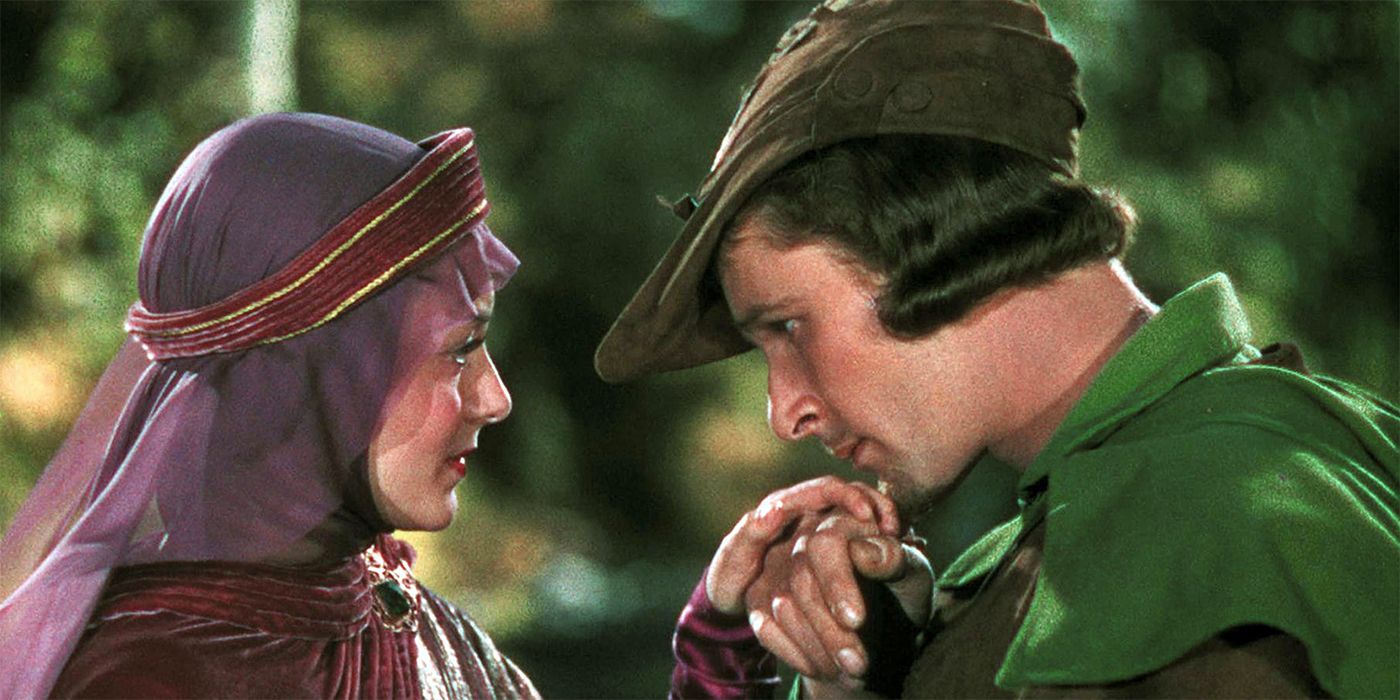 Robin Hood kissing Maid Marion's hand in The Adventures of Robin Hood.