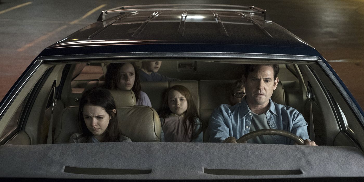 A man driving several distressed kids in The Haunting of Hill House