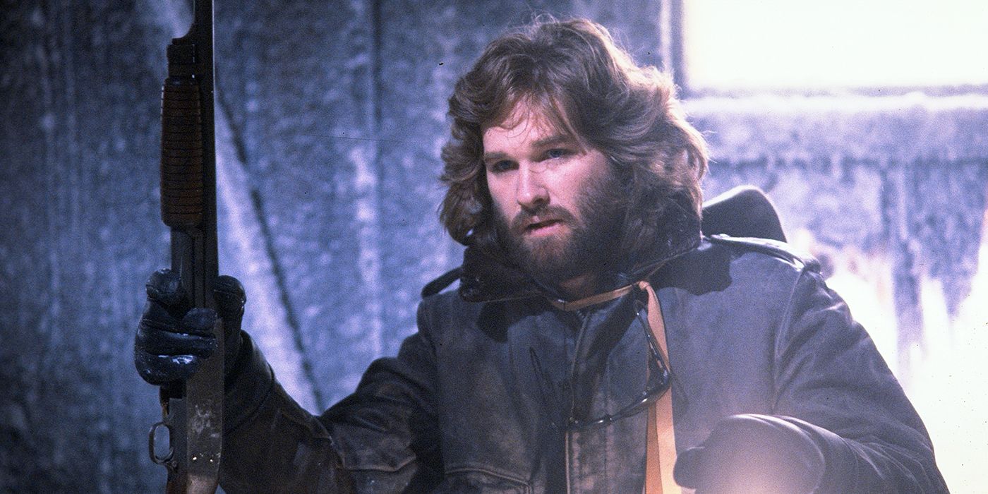 R.J. MacReady (Kurt Russell) holds a shotgun and a lantern in 'The Thing'