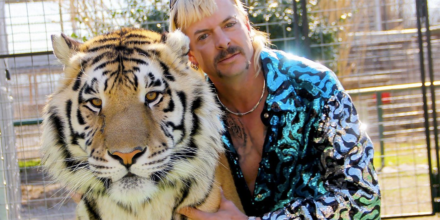 Joe Exotic hugging a tiger in a scene from Tiger King