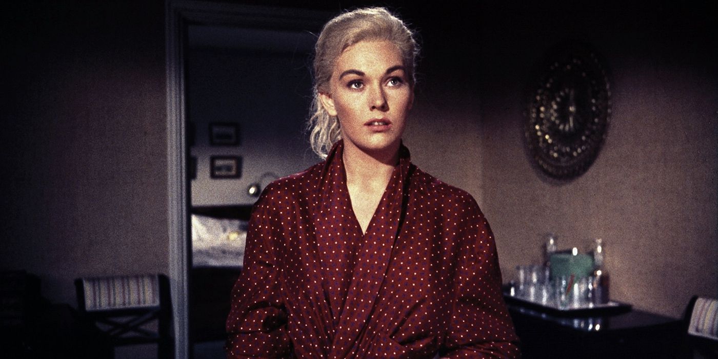 Judy wearing a robe and looking intently in Vertigo.
