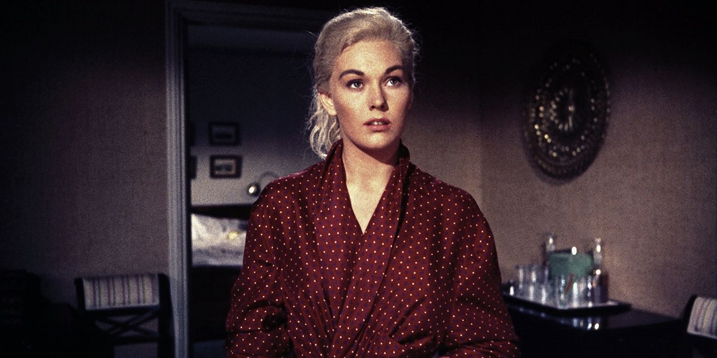 Judy (Kim Novak) wearing a robe and looking intently in Vertigo (1958).