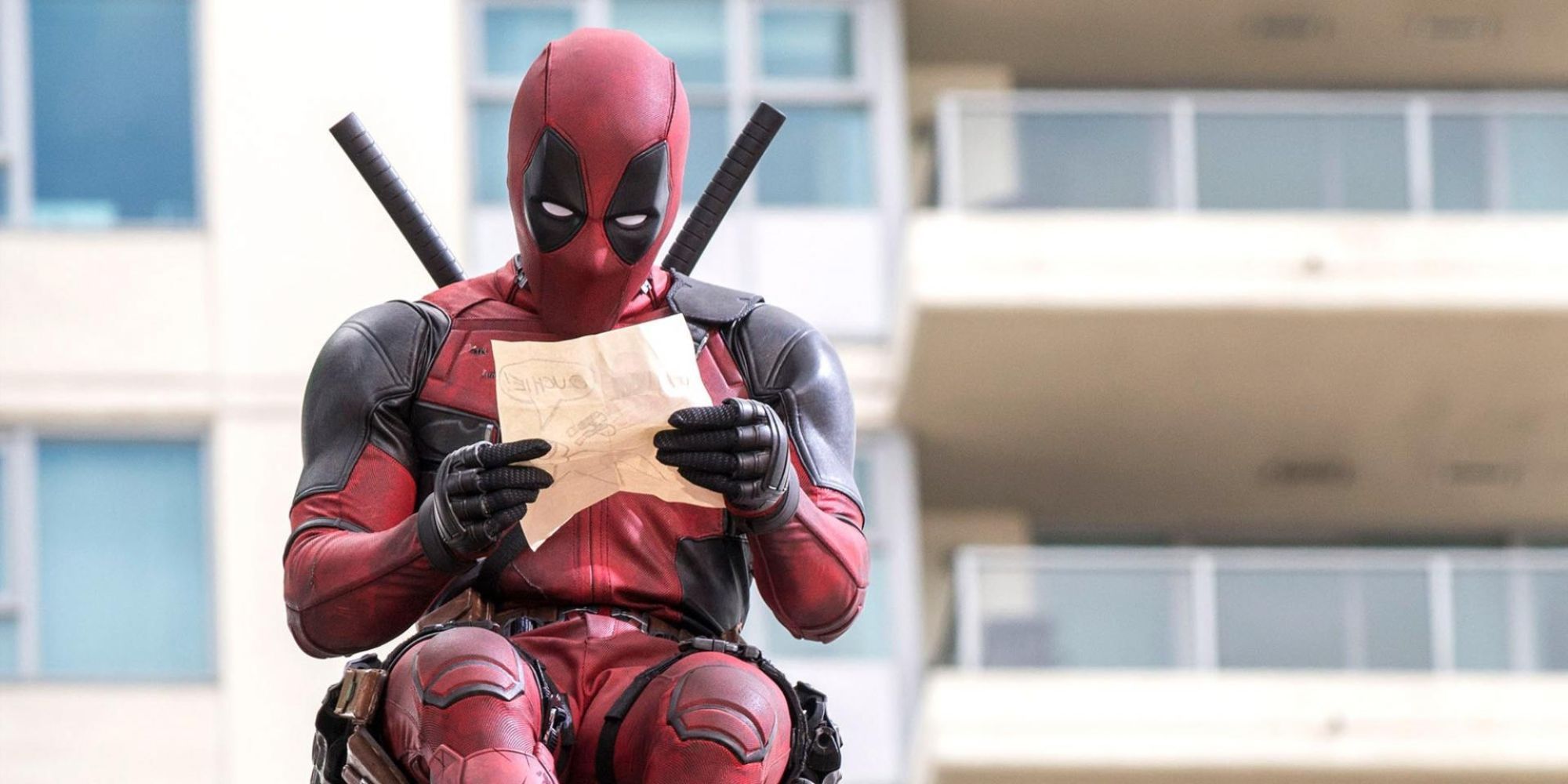 Still image from Deadpool, featuring Deadpool reading a letter.