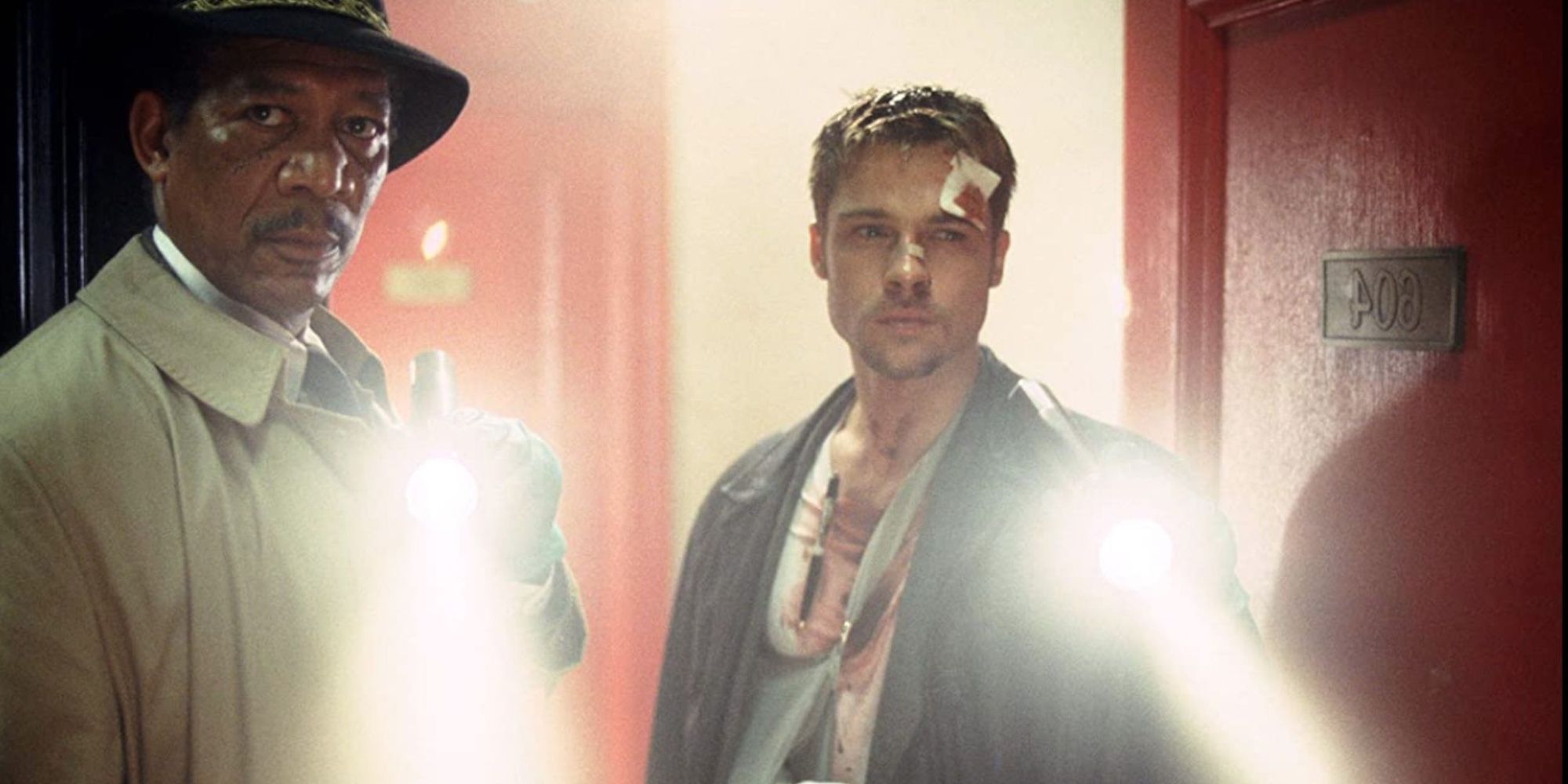 Morgan Freeman and Brad Pitt holding flashlights in Se7en