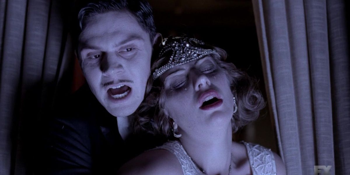 American Horror Story Alexandra Daddario being held by Evan Peters in the hotel while crying