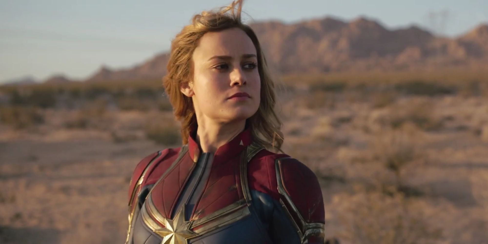 Brie Larson looking heroic in a desert in Captain Marvel