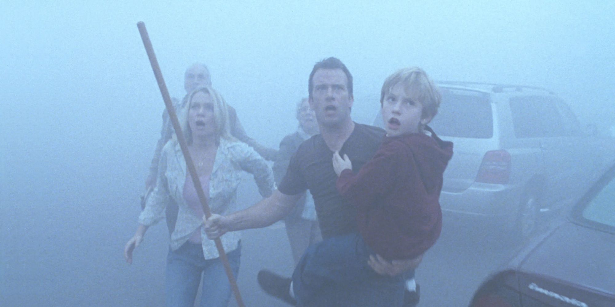 Wielding a stick as a weapon, a father leads a small group of survivors through a deadly and mysterious fog. 
