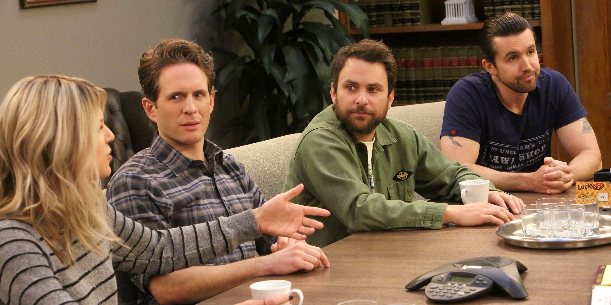 The Gang sat around a table in 'Hero or Hate Crime'