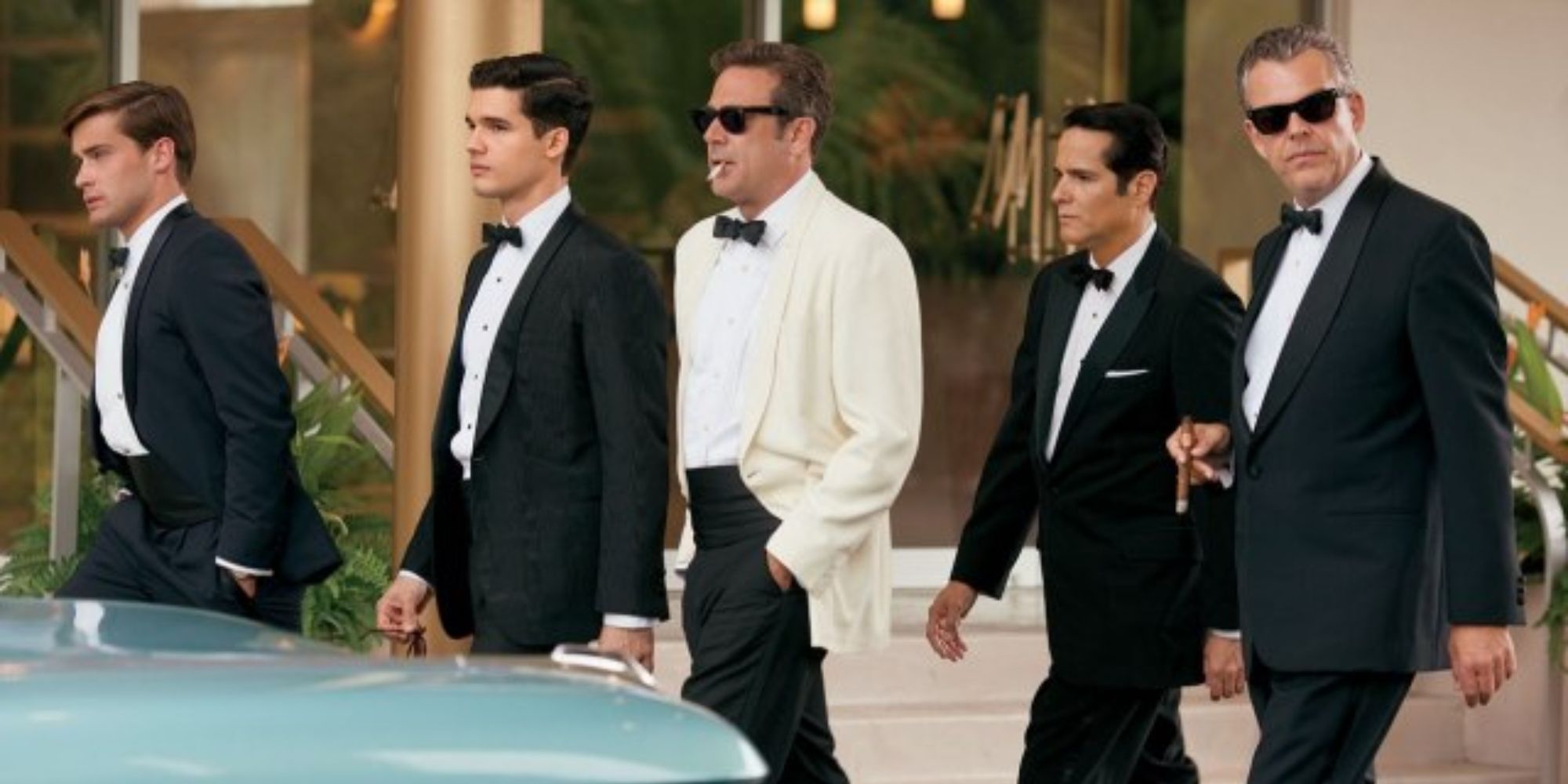 Men walking in tuxes in Magic City