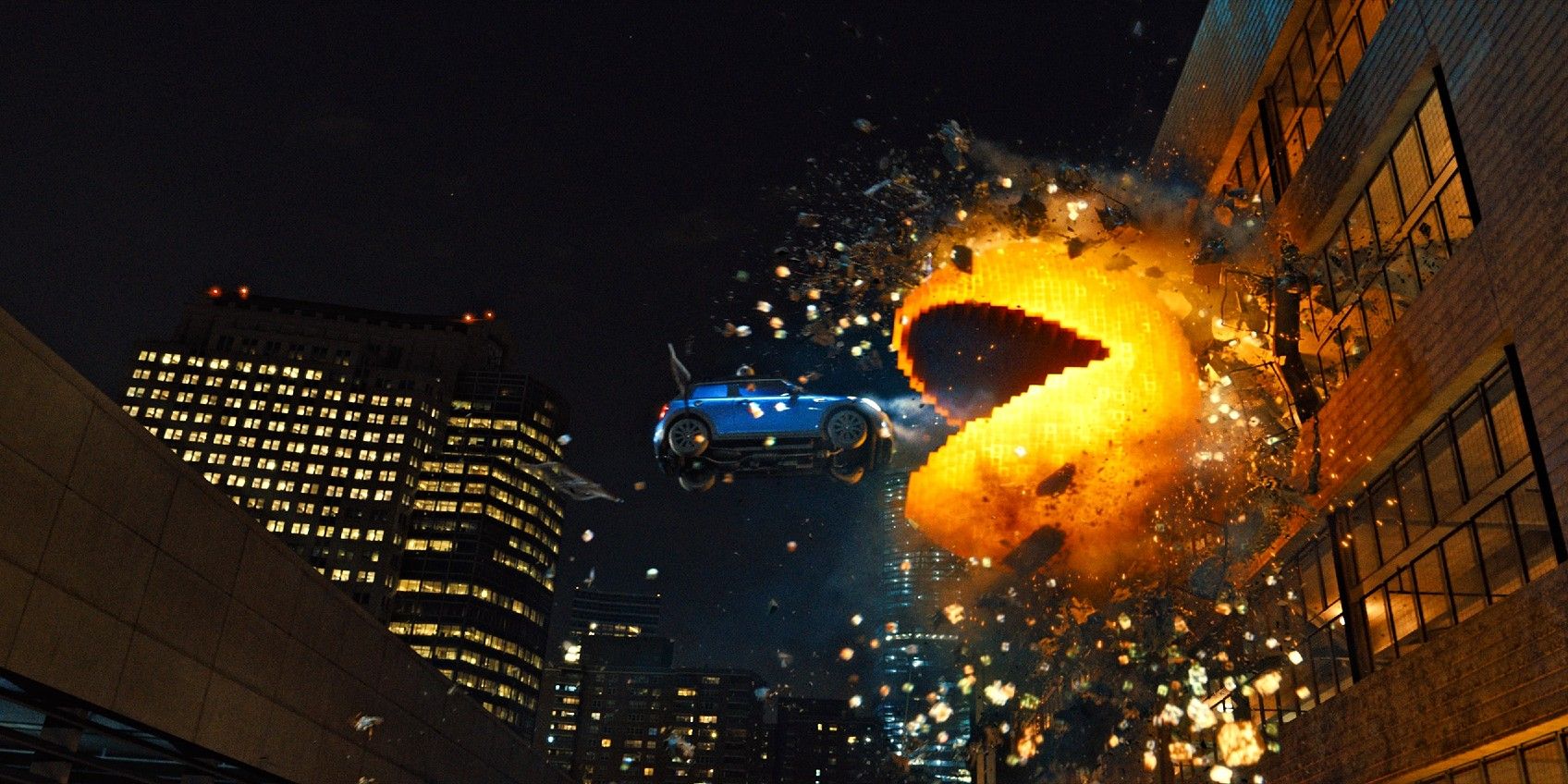 A giant Pacman eating a car in Pixels (2015)