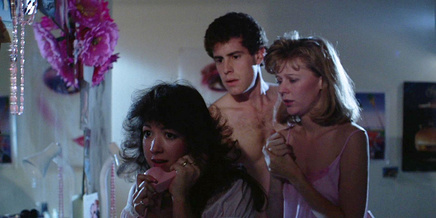 Linda (Wendy Martel) taking a phone call while Sara (Pamela Ross) and Craig (Joe Nassi) look concerned in Sorority House Massacre