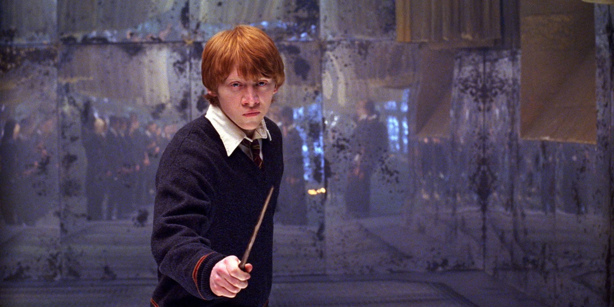 Ron Weasley (Rupert Grint) raising his wand and looking determined in Harry Potter and the Order of the Phoenix