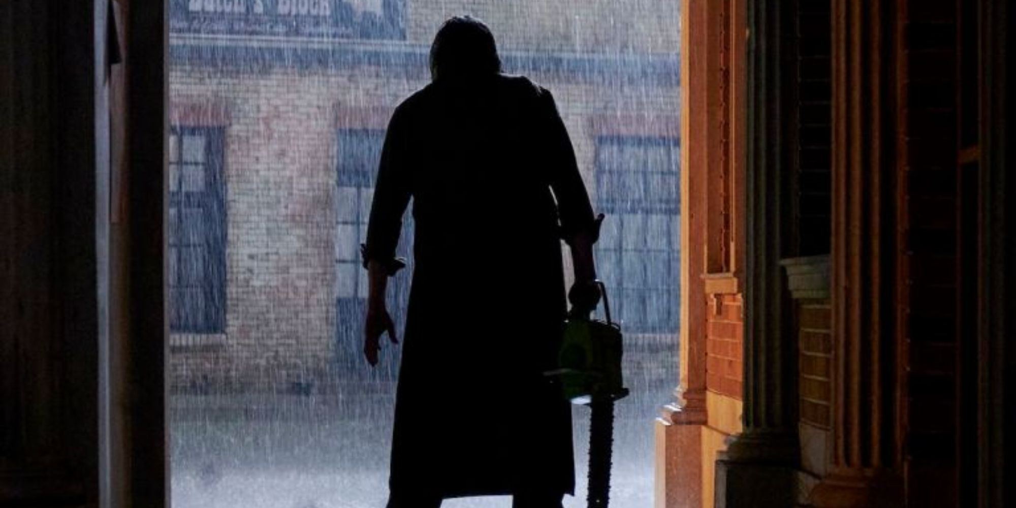 Leatherface standing in the rain