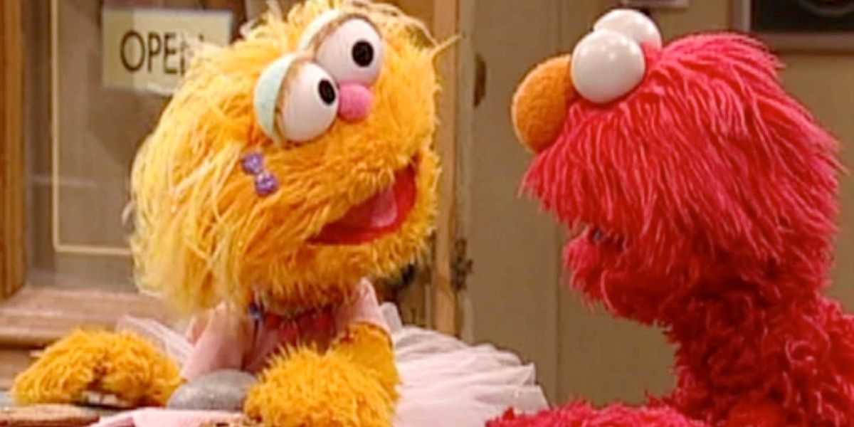 Zoe and Elmo argue about giving Rocco a cookie on Sesame Street.