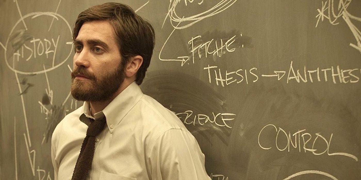 College history professor Adam Bell (Jake Gyllenhaal) stands against a blackboard in 'Enemy'.