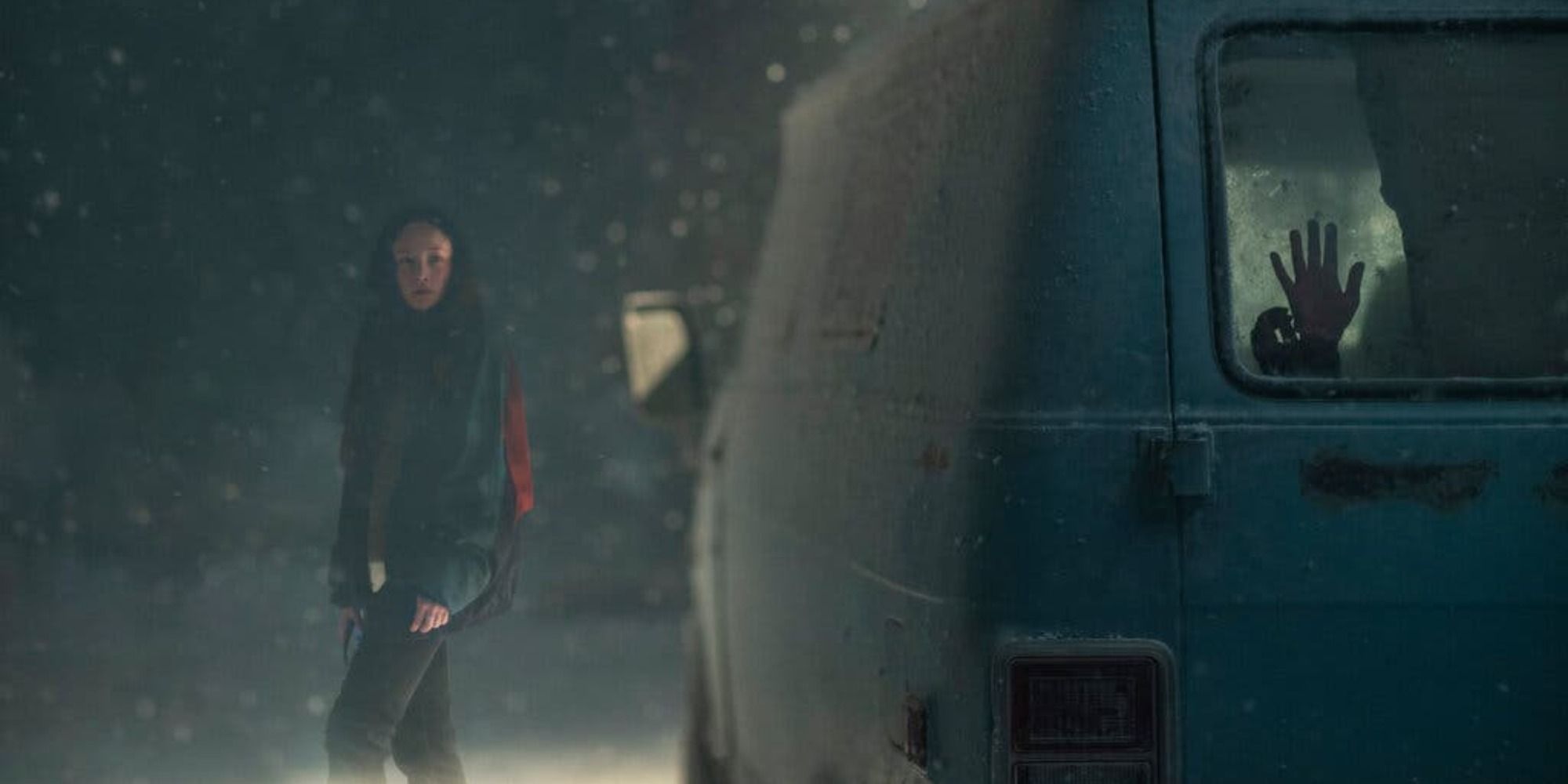 A young woman in a snowstorm looks suspiciously at a van where a young girl is being held hostage