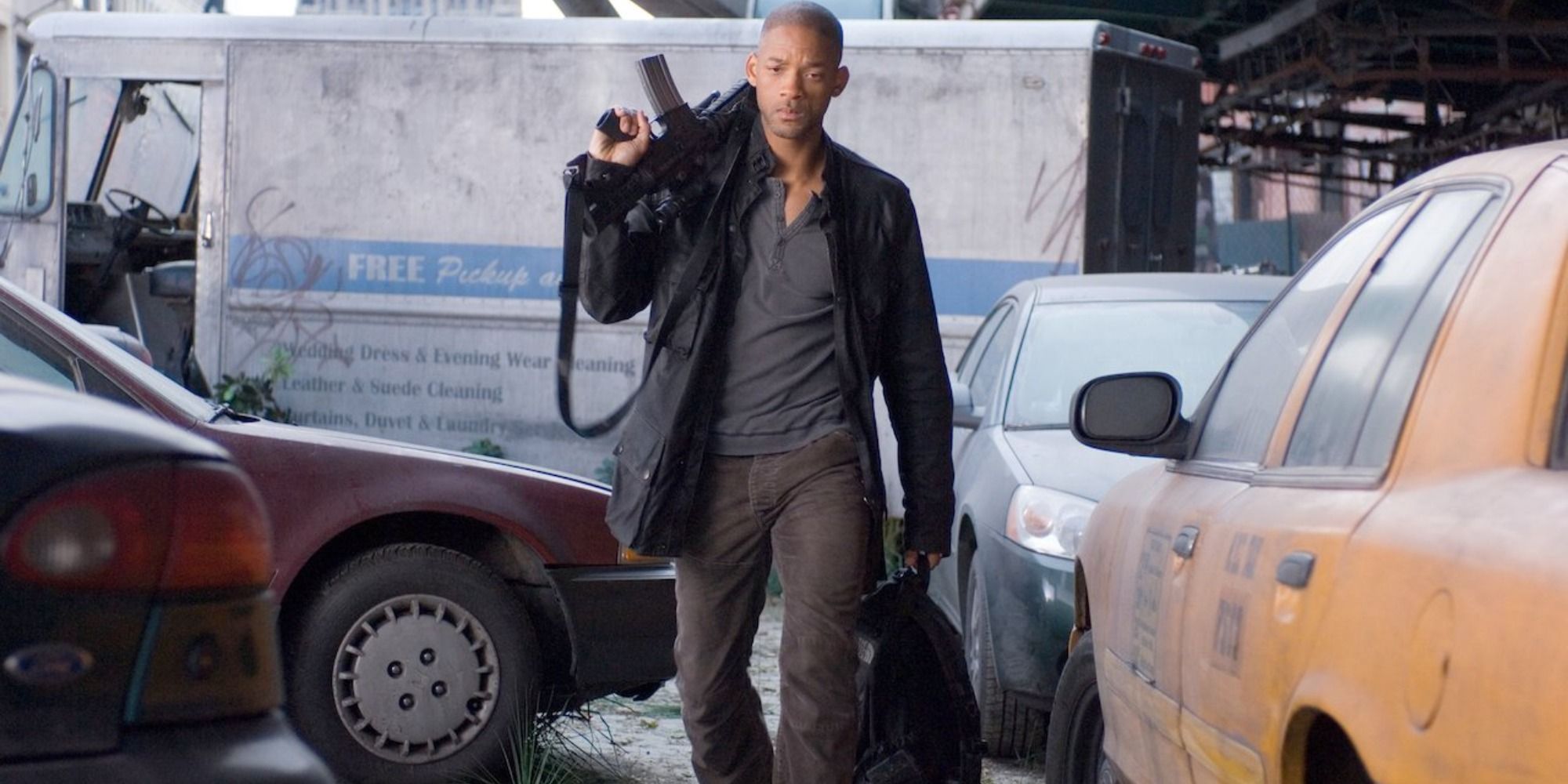 Will Smith holding a gun and walking down the street in I Am Legend 2007
