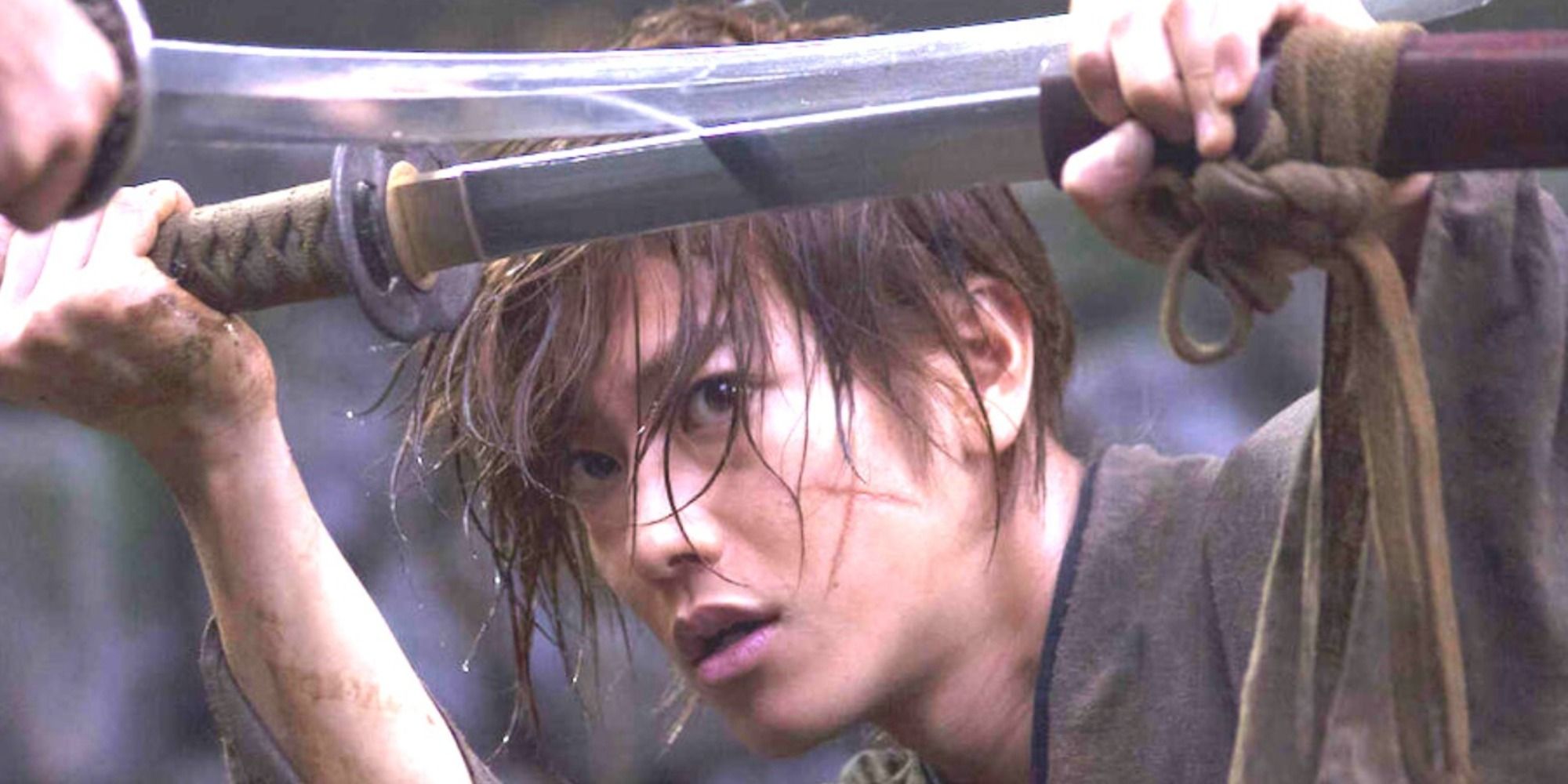 Kenshin blocking a sword with his own in Rurouni Kenshin