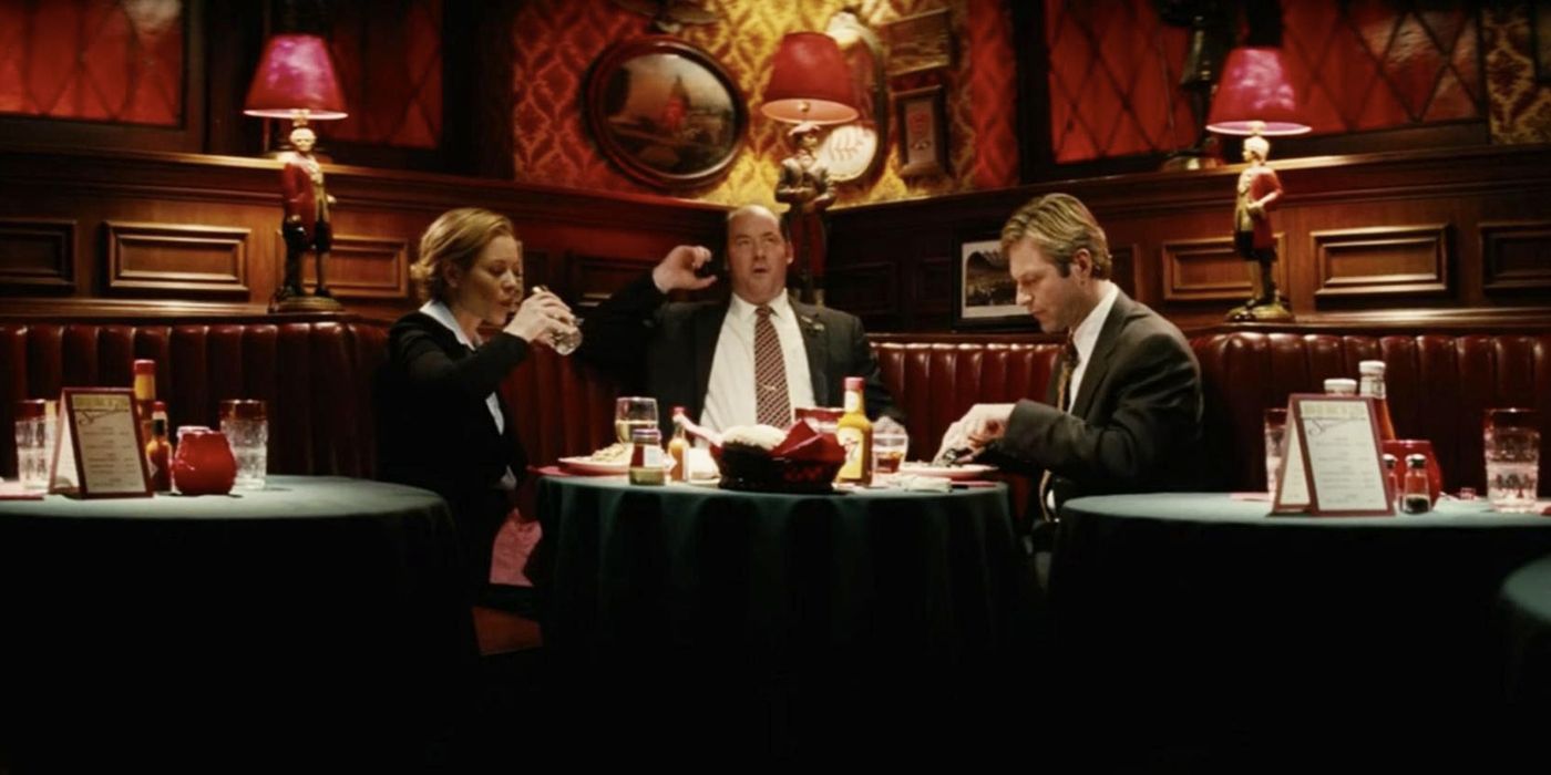 Maria Bello as Polly Bailey, David Koechner as Bobby Jay Bliss and Aaron Eckhart as Nick Naylor sitting around a table in Thank You For Smoking