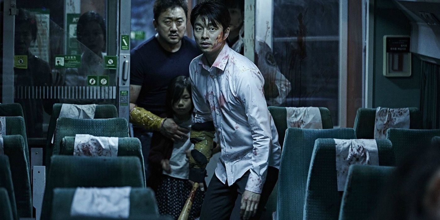 A group of people sneaking up a zombie-infested train