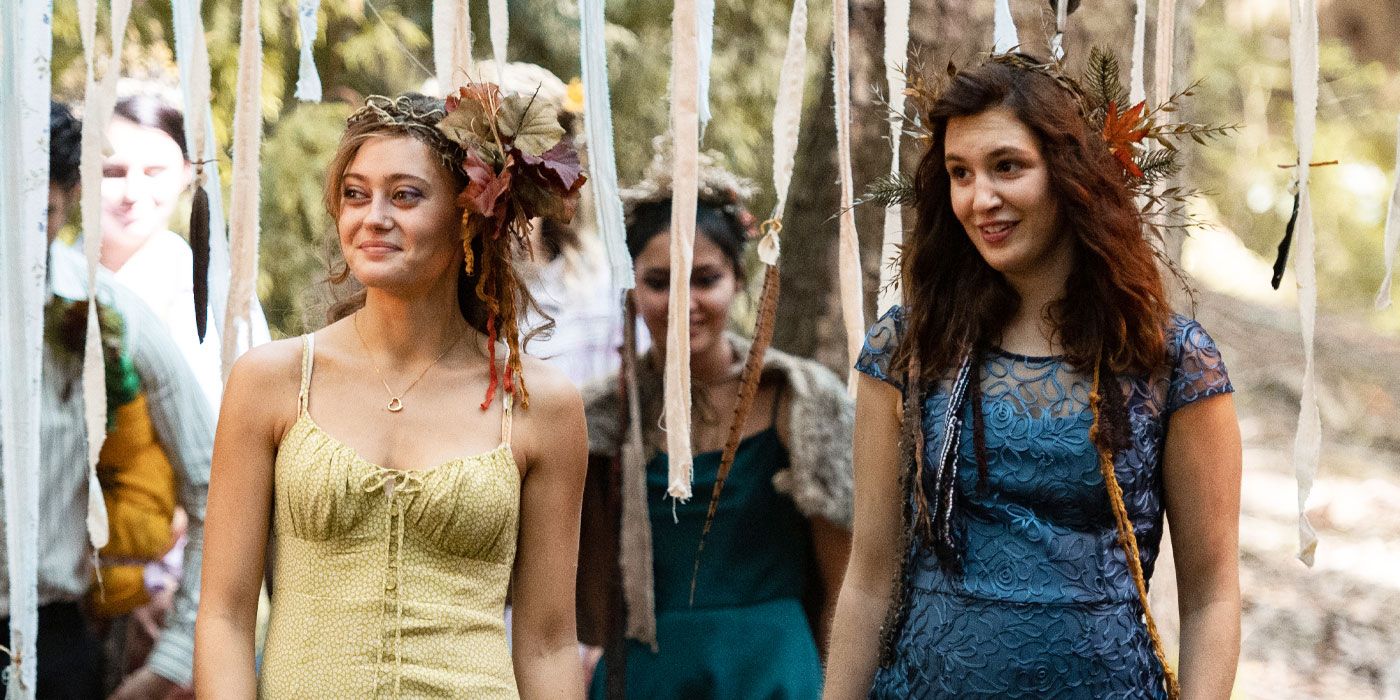 Ella Purnell and Sophie Nelisse in Yellowjackets dressed up for a makeshift party in the wild.