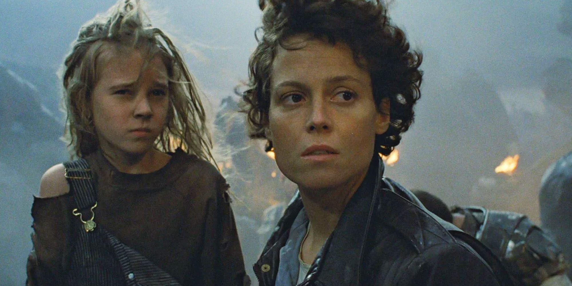 Sigourney Weaver as Ellen Ripley and Carrie Henn as Newt in Aliens