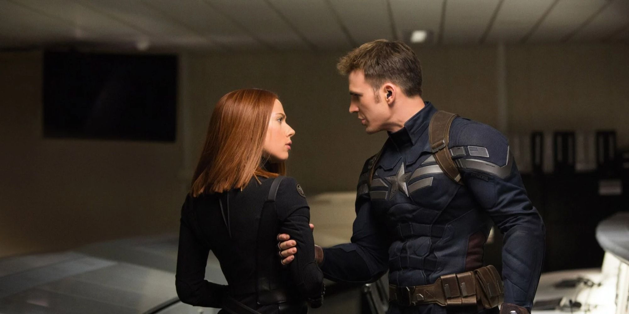 Steve Rogers and Black Widow staring at each other on a mission 