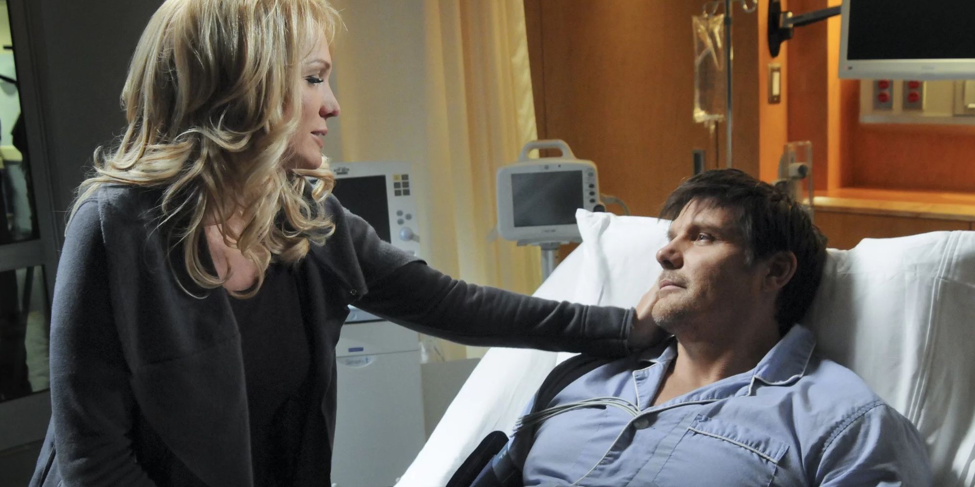 Barbara Alyn Woods and Paul Johansson as Deb and Dan Scott, as Dan lays dying in a hospital bed on One Tree Hill