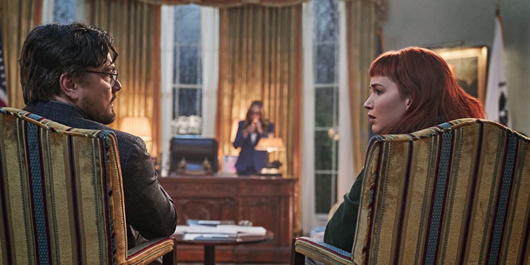 Leonardo DiCaprio and Jennifer Lawrence sitting in the President's Office in 'Don't Look Up'