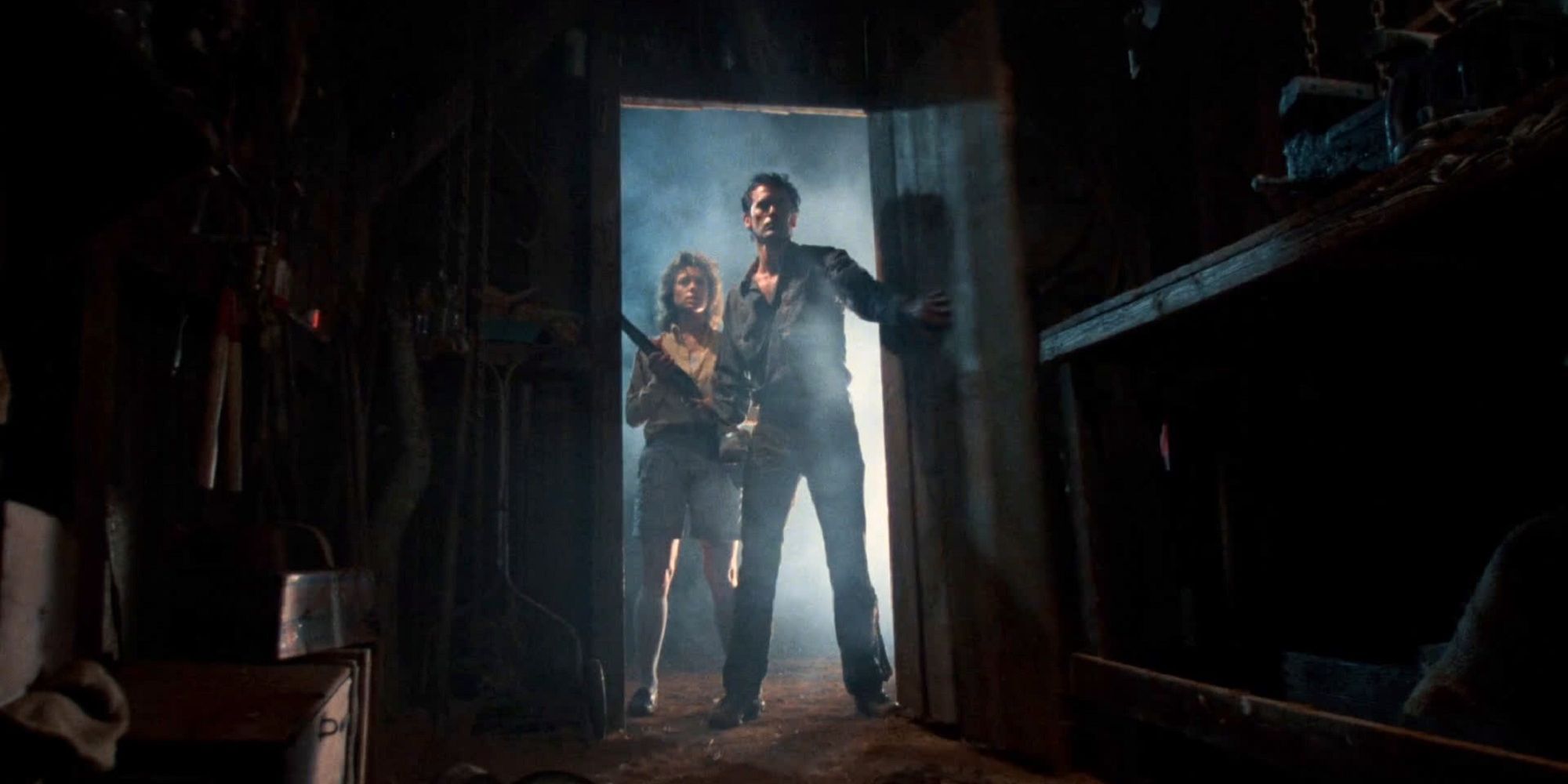 Bruce Campbell and Sarah Berry enter the tool shed in Evil Dead II