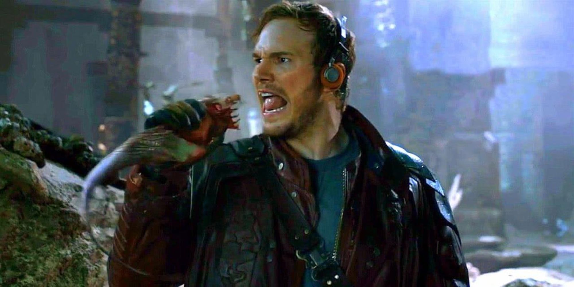 Chris Pratt as Star-Lord, singing into a rodent alien like it&rsquo;s a microphone in Guardians of the Galaxy.